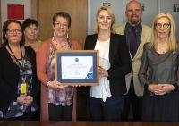 Wellington Mayor Celia Wade-Brown, centre left, receives the CEMARS certificate from the Chair of Enviro-Mark Solutions Vicky Taylor.