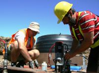Sam Carrick and Graeme Rogers work on a plate to go under a lysimeter.