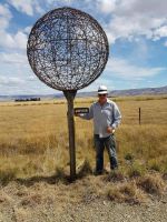 Ian Griffin 'planting' a scale model solar system on the Central Otago Rail Trail