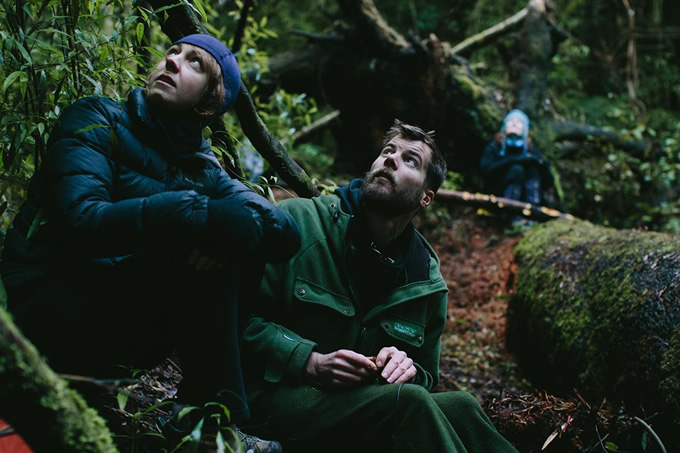 Amanda Rogers and Dave Bryden operating the recording controls to lure in a wild kōkako.