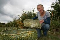 Landcare Research flax collection curator Katarina Tawiri with some of the wahakura produced.