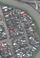 Silt-laden waters flooding Christchurch streets hours after the 4 September 2010 earthquake. Image (c) Geoeye 2010.