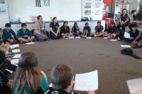 Students discussing their garden designs 