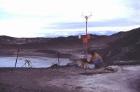 Ian Hawes downloading data from a climate station at Bratina Island. 