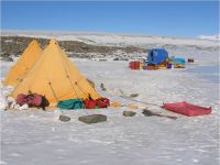Our campsite on the snow. We slept in the polar tents and prepared our meals, ate and packed our soil samples in the large Polarhaven tent . (McLeod)