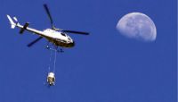 Aerial delivery of toxic bait. Image - Graham Nugent.