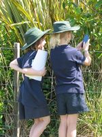 Paroa students using the iNaturalist app to record plants growing in and around their school grounds. Photo: Hugh Gourlay, Manaaki Whenua - Landcare Research