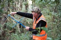 Manaaki Whenua’s Grant Morriss with a radio transmitter.