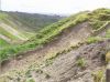 Soil erosion in Manawatu hill country following heavy rain.