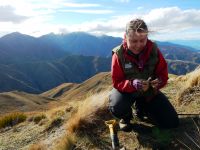 Landcare Research scientist Barbara Anderson digs up tea bags on the sunny side of the mountain (1300m). 