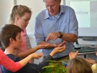 Hugh Gourlay showing Kaniere School students biocontrol insects