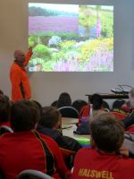 Ian Hankin (DOC) speaking to Halswell School students about purple loosestrife control in Canterbury. Photo: Murray Dawson