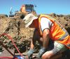 Sam Carrick setting up a large scale lysimeter in stony soil (Caroline King).