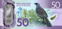 Pureora forest and Waihora lagoon in the background, with the Entoloma hochstetteri mushroom and a blue-wattled kokako. The NZ $50 note is the only note worldwide to feature fungi. 