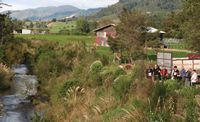 Management of the Sherry River being discussed on an ICM Motueka field trip for New Zealand and Chilean visitors