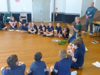 Robinne Weiss with Paroa School students explaining traditional uses of weeds. Photo: Murray Dawson, Manaaki Whenua - Landcare Research