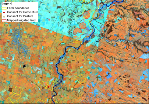 Figure 1. An example of irrigated land (red line) mapped on a mosaic of SPOT images in false colours. Cyan colour represents bare ground (dry or ploughed fields, cities, roads), shades of orange represents levels of green pasture. The upper part of the mosaic was taken from imagery during a dry period.