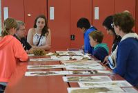 Ines Schonberger explaining about herbarium specimens to students and their caregivers